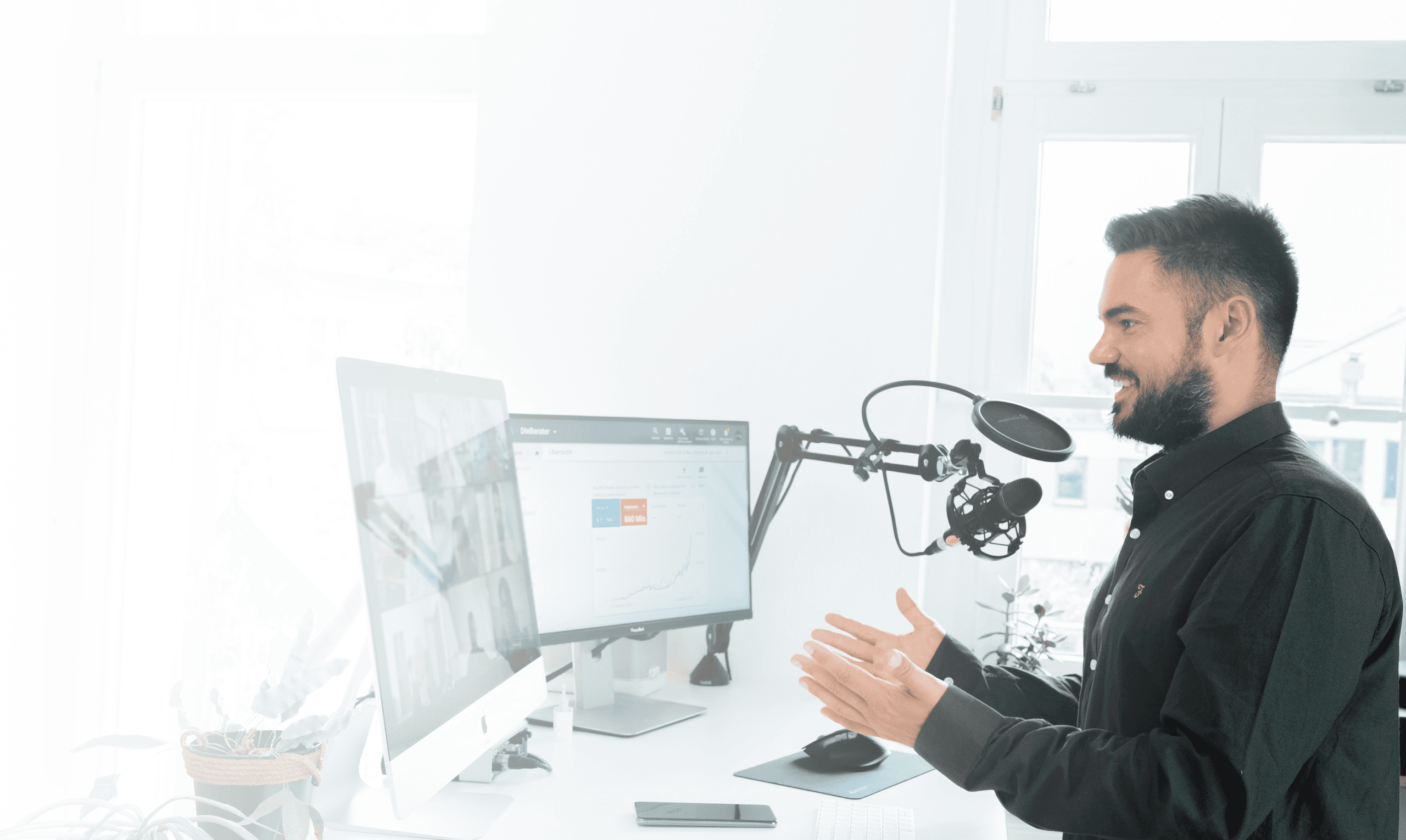 man speaking at desk